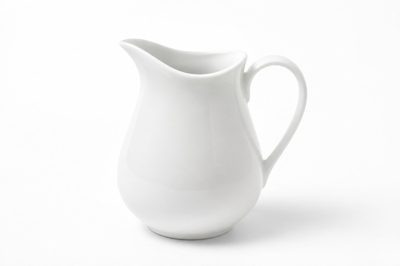 White ceramic pitcher on pure white — high-key study