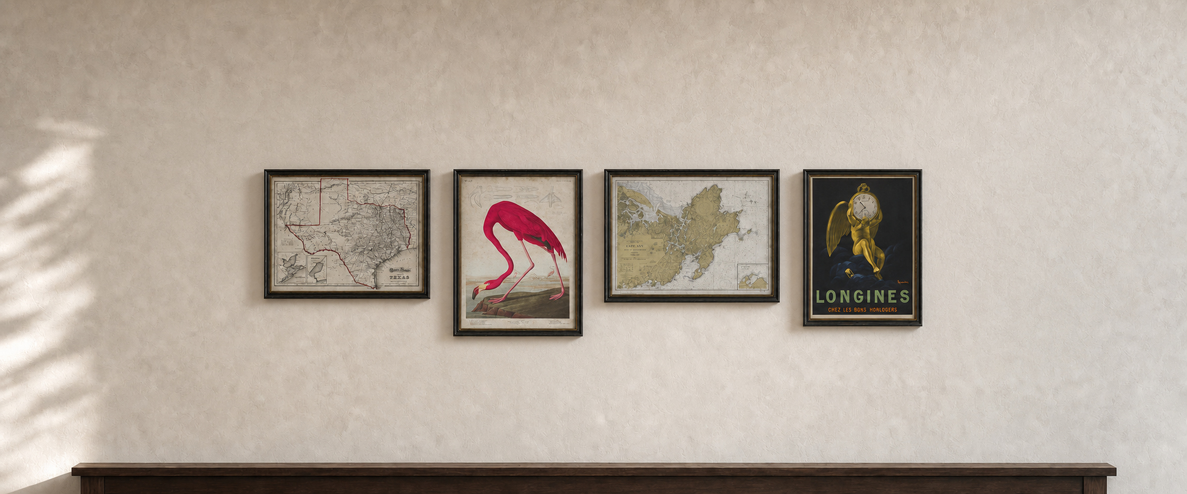 Four restored Archive Print Co. works displayed in black gallery frames